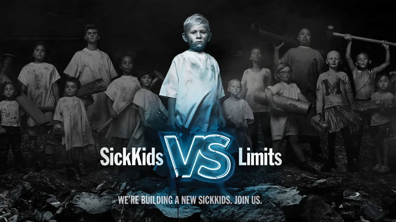 A black and white photo of a boy in a hospital gown